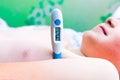 Close up side view flu sick lying down schoolboy with medical thermometer in armpit health illness