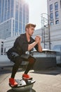 Handsome man doing squats on fit ball. muscle stimulation Royalty Free Stock Photo