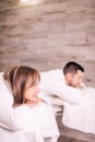 Close up side view photo. gorgeous young man and woman lying on the massage beds