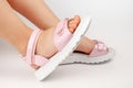 close-up side view of pink children& x27;s leather sandals with flat soles, two comfortable shoes on the child& x27;s feet Royalty Free Stock Photo