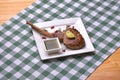 Close up side view on single barbecued rib tip with rosemary, salt, herbs and pomegranate seeds. Tomahawk steak. Royalty Free Stock Photo