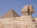 Close up of the Side view of the of the Sphinx statue Giza Egypt with the Great Pyramid in the background. Royalty Free Stock Photo