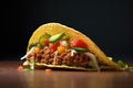 close-up side view of a taco with a chili pepper sticking out