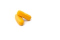 Close up side view of two orange pills which are isolated over the white background. Royalty Free Stock Photo