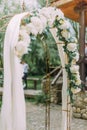Close-up side view of the wedding arch with white flowers. Royalty Free Stock Photo