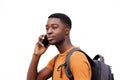 Close up side of young black man talking on cellphone against white wall Royalty Free Stock Photo