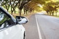 Close up Sideview mirror white cars beside