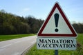 Road traffic sign indicating mandatory vaccination Royalty Free Stock Photo