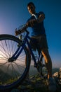 Close up silhouette of an athlete mountain biker riding his bike on rocky mountains Royalty Free Stock Photo