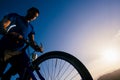 Close up silhouette of an athlete mountain biker riding his bike on rocky mountains Royalty Free Stock Photo