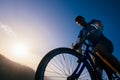 Close up silhouette of an athlete mountain biker riding his bike on rocky mountains Royalty Free Stock Photo