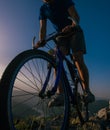 Close up silhouette of an athlete mountain biker riding his bike on rocky mountains Royalty Free Stock Photo
