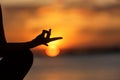 Close up Silhouette hands. Woman do yoga outdoor. Woman exercising vital and meditation for fitness lifestyle club at the sunset b Royalty Free Stock Photo