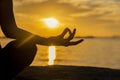 Close up Silhouette hands. Woman do yoga outdoor. Woman exercising vital and meditation for fitness lifestyle club at the sunset b