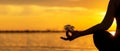 Close up Silhouette hands. Woman do yoga outdoor. Woman exercising vital and meditation for fitness lifestyle club at the sunset b Royalty Free Stock Photo