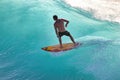 Close-up of a silhouetted surfer on a clean aquamarine wave on Maui. Royalty Free Stock Photo