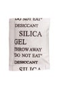 Close up silica gel or desiccant in paper bag on white background