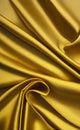 Close up silk fabric yellow, luxury themed abstract background. Silk fabric golden, satin fabric wave background.