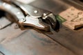 Close-Up of a Silver Adjustable Wrench Resting on a Workshop Table Royalty Free Stock Photo