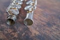 Close up of silver alto flute on a wooden table