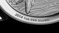 Close up of Silver Bullion Coin on a black mirror background Royalty Free Stock Photo