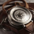 close-up of a silver compass with a leather strap one generative AI Royalty Free Stock Photo