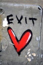 a red heart painted on the side of a silver and gray truck