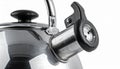 Close Up of a Silver Metal Kettle with Black Handle and Spout on White Background Royalty Free Stock Photo