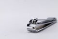 Close-up of Silver Nail Clipper on White Background, Manicure Tool Royalty Free Stock Photo