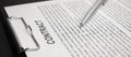 Close-up of a silver pen on docunent contract. Legal contract signing, buy sell real estate contract agreement sign on document Royalty Free Stock Photo