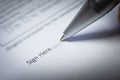 Close-up of silver pen are signing the contract policy agreement papers. Legal contract signing Royalty Free Stock Photo