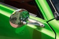Close up Silver Rearview mirror on green car Royalty Free Stock Photo