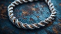 Close-up silver rope bracelet on wooden surface Royalty Free Stock Photo
