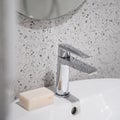 Close-up on silver tap and soap bar Royalty Free Stock Photo