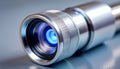 Close Up Silver Telescope Lens with Blue Light Reflection on Metallic Surface Royalty Free Stock Photo