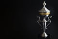 Close up of Silver trophy over black background. Winning awards with copy space for text and design. Royalty Free Stock Photo