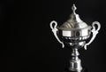 Close up of Silver trophy over black background. Winning awards with copy space for text and design. Royalty Free Stock Photo