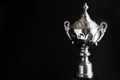 Close up of Silver trophy over black background. Winning awards with copy space for text and design. Royalty Free Stock Photo