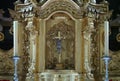 Close-up of a silvered altar with a crucifix with Jesus Christus of Nazareth nailed to the cross