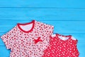 Close up of simple cotton baby dresses.