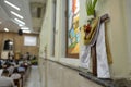 Close up of Simple Wooden Christian Cross Hanging on Wall