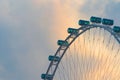 Close up of Singapore flyer, a ferris wheel, located in Singapore City Downtown with sunset sky Royalty Free Stock Photo