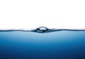 Close up of a single bubble rising through clear blue water Royalty Free Stock Photo
