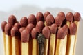 Close-up of a single burnt match in a group of matches Royalty Free Stock Photo