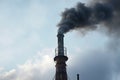 close-up of a single factory chimney expelling thick smoke