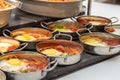 Close up of single servings of shakshuka a traditional Israeli egg dish with tomato