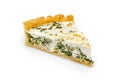 Close up of a single slice of Spinach and feta cheese pie isolated on white