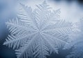 Close-up of a single snowflake displaying intricate, symmetrical Royalty Free Stock Photo