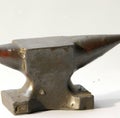 Close up of single steel anvil lying on white background