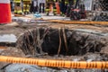 close-up of sinkhole, with ropes and safety gear for rescue workers visible